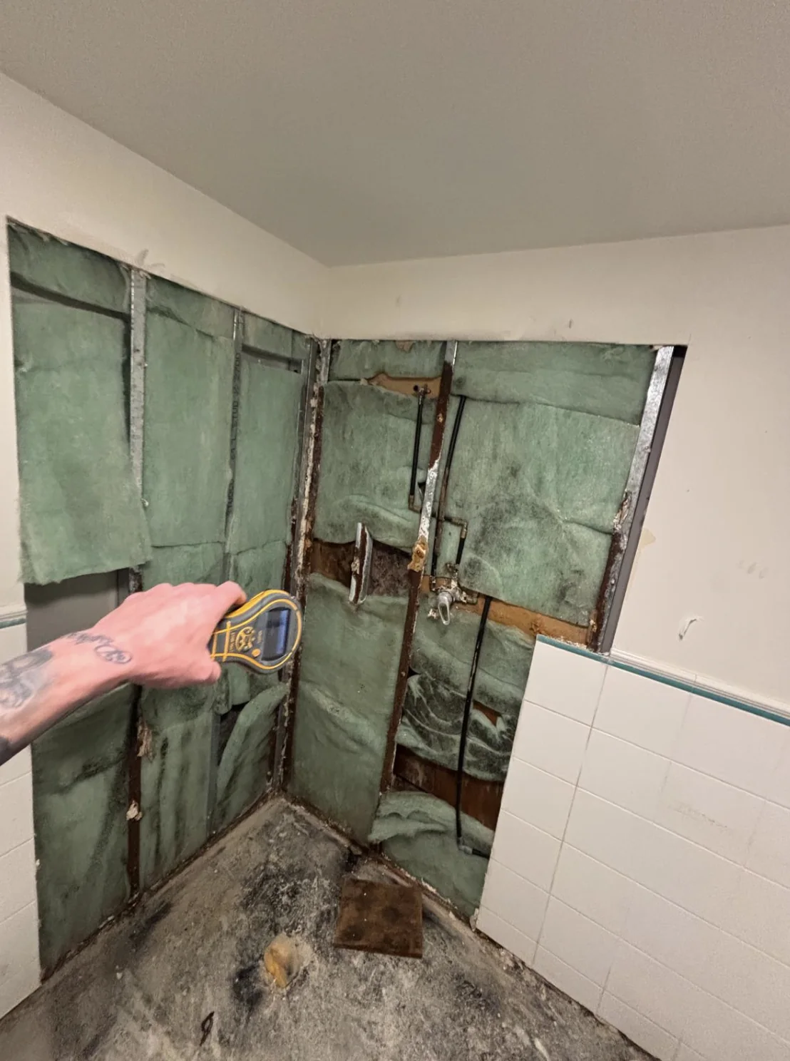 Moisture testing inside an opened wall cavity